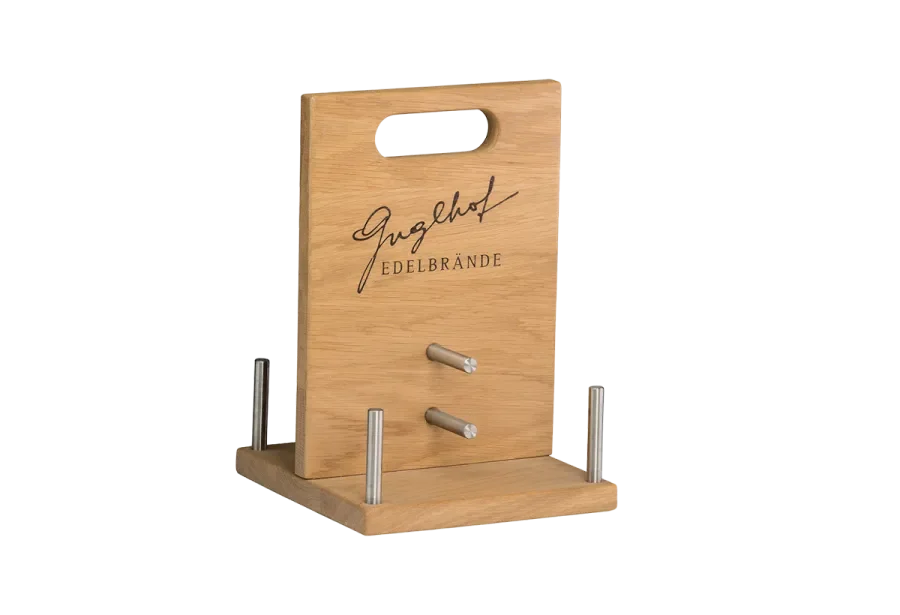 Bottle carrier for noble brandies made of solid wood with stainless steel holder