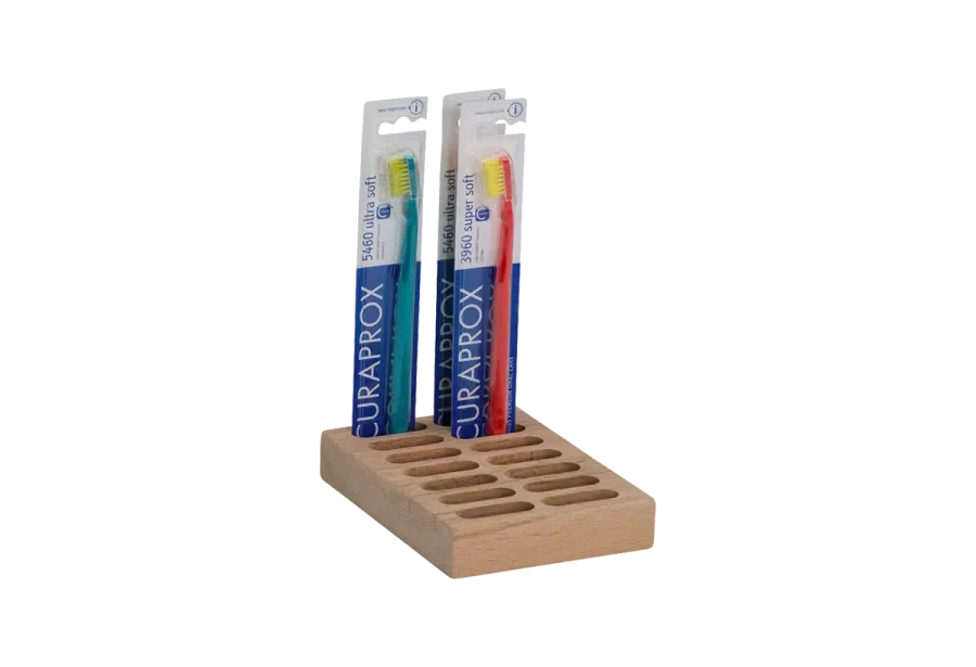 Wooden display for toothbrushes with separating insert
